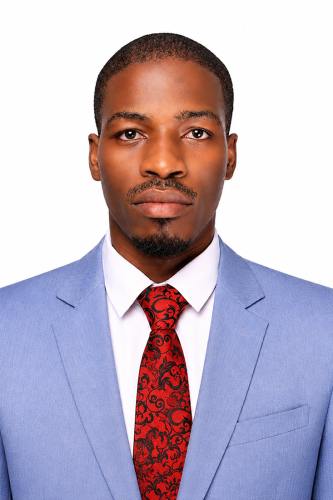 JohnBaptist Galiwango stands for headshot picture, background removed.