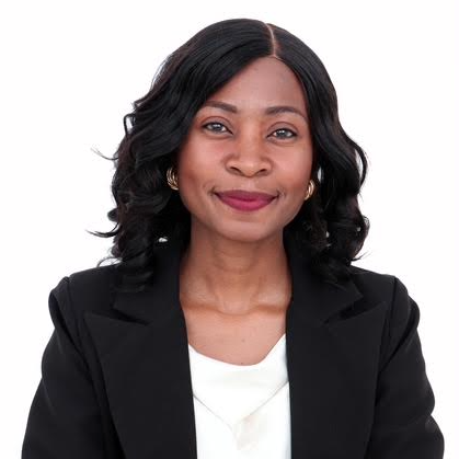 Musonda Mandona stands for a headshot photo, background has been removed and tuned white.