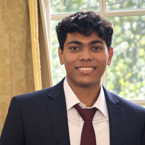 Tanvin Araen standing in front of a window for a picture